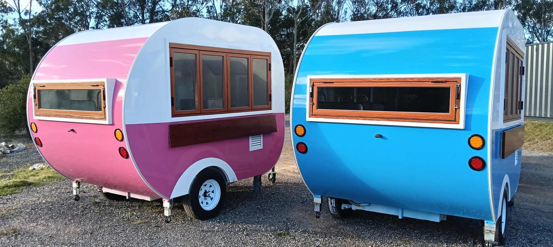 Pink and blue teardrop food trailers with timber-look serving windows